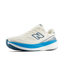 White running shoe with blue sole on a white background