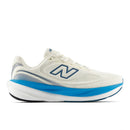 White running shoe with blue sole on a white background