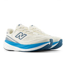 White running shoe with blue sole on a white background