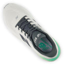 Gray and green running shoe with New Balance logo on a white background