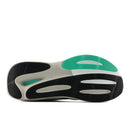 Sole of a shoe with black, white, and green color pattern on a white background