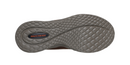 The textured gray outsole of a Skechers shoe, showing the brand logo in red and black near the heel, on a solid white background.