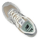 Gray and beige sneaker with white laces on a white background