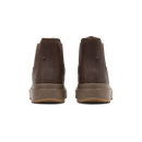 A pair of dark brown leather Chelsea boots shown from the back, featuring elastic side panels and thick brown soles with the brand name 'Kizik' embossed.
