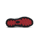 The outsole of a Kizk brand shoe, showing a black treaded rubber bottom with a bright red inner sole and a black center logo plate.