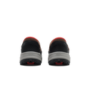 A pair of Kizk brand athletic shoes shown from the back, featuring a black mesh upper, a brown collar, a bright red heel tab, a light gray midsole, and a black outsole with red detailing.