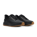 A pair of black low-top work sneakers with brown gum soles and silver metal eyelets, shown on a clean white background.