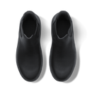 A pair of black leather Chelsea-style ankle boots shown from a top-down view on a white background.
