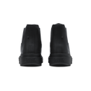 A pair of black ankle boots shown from the back, featuring a matte finish and the brand name 'kizik' embossed on the sole, set against a plain white background.