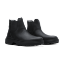 A pair of black Chelsea-style ankle boots with elastic side panels and chunky lug soles, photographed on a clean white background.