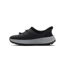 Black slip-on sneaker with a white sole on a transparent background