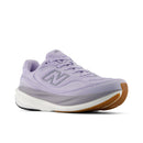 Purple sneaker with brown sole on a white background
