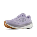 Purple running shoe with brown sole on a white background