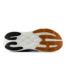 Close-up of a shoe sole with black, white, and brown colors on a white background