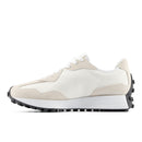White sneaker with beige accents on a white background