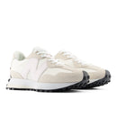 Pair of white and beige sneakers on a white background
