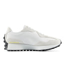 White sneaker with black sole on a white background
