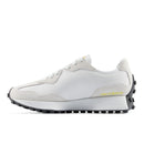 White sneaker with black sole on a white background