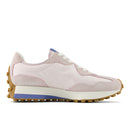 Pink sneaker with a white sole on a white background