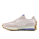 Pink sneaker with a white sole on a white background