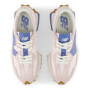 Pair of pink sneakers with blue accents on a white background