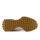 Close-up of a shoe sole with brown textured pattern on a white background