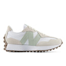 White and beige sneaker with green accents on a white background