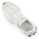 White sneaker with beige accents on a white background