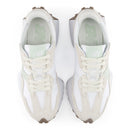 Pair of white sneakers with brown accents on a white background