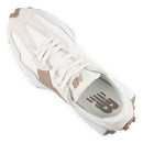 White sneaker with brown accents on a white background