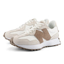 Pair of beige and white sneakers on a white background