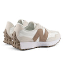 Pair of beige and white sneakers on a white background