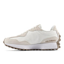White and beige sneaker with 'New Balance' branding on a white background