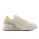 Beige sneaker with yellow accents on a white background