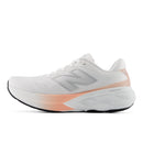 White running shoe with pink accents on a white background