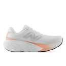 White and pink running shoe on a white background