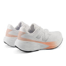 White running shoes with pink accents on a white background